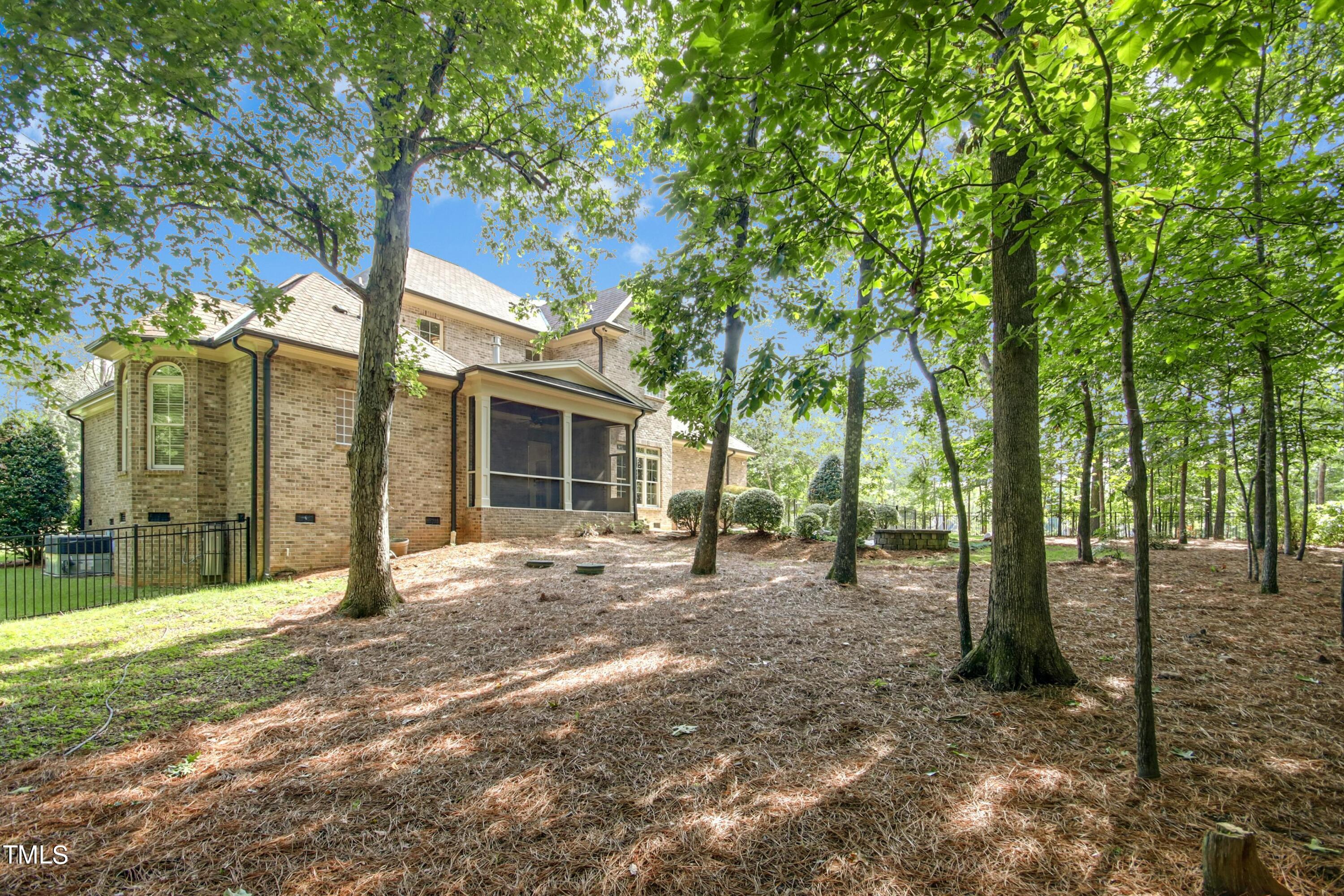 5513 Hickory Leaf Drive Raleigh, NC 27606 - Photo 29 of 41 a view of a house with backyard and trees