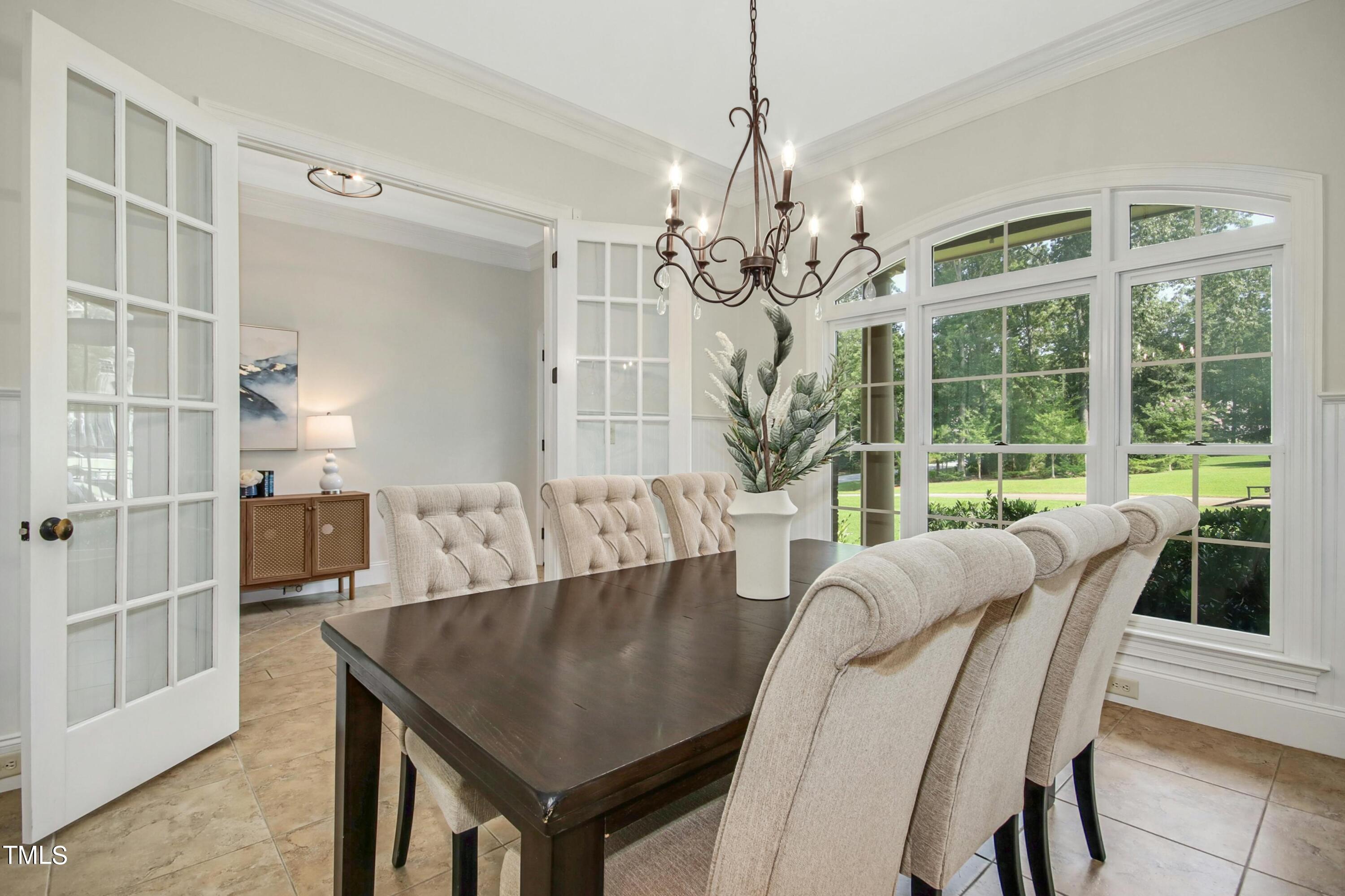 5513 Hickory Leaf Drive Raleigh, NC 27606 - Photo 4 of 41 a view of a dining room with furniture window and outside view