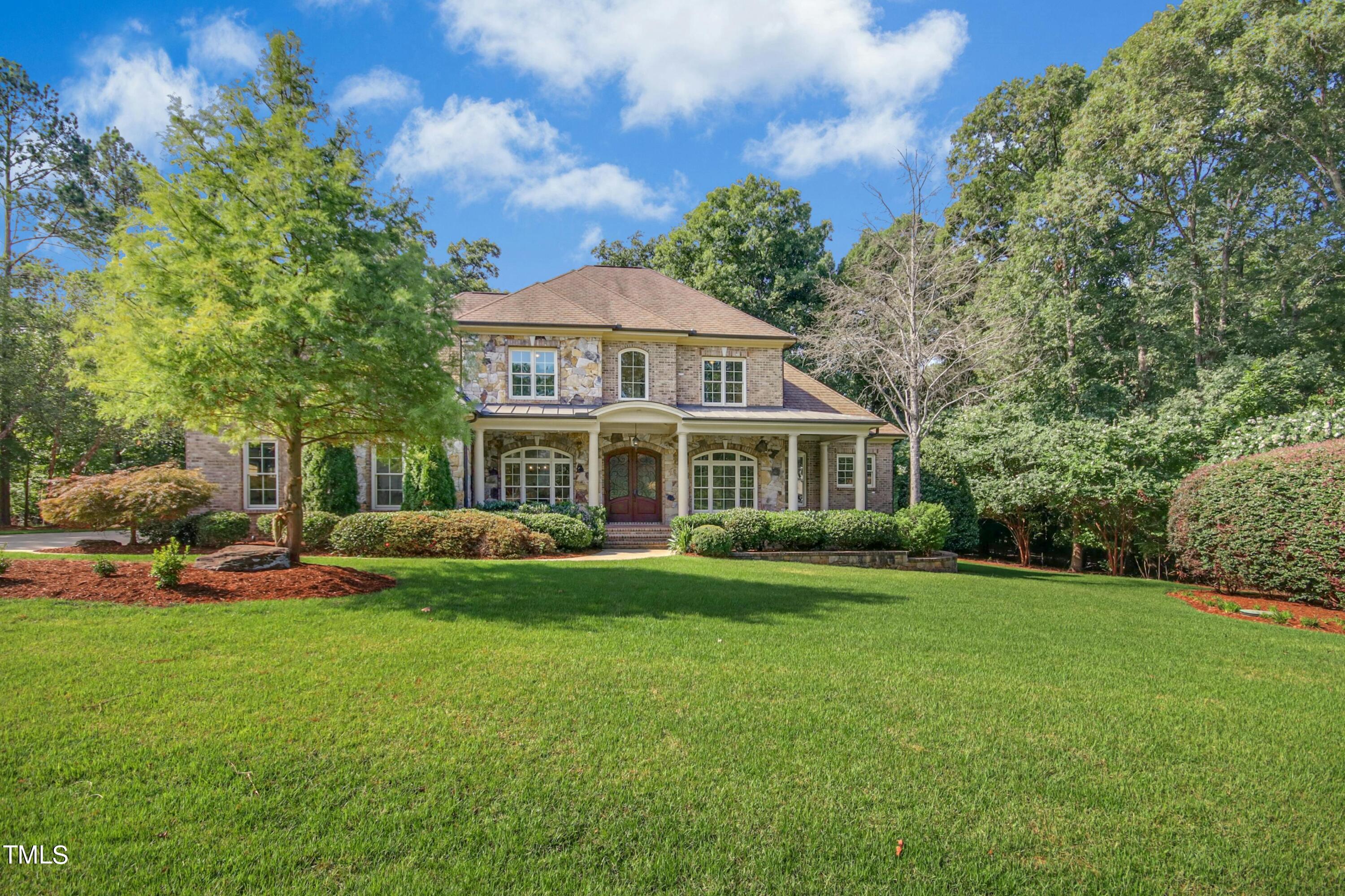 5513 Hickory Leaf Drive Raleigh, NC 27606 - Photo 41 of 41 a front view of a house with a garden