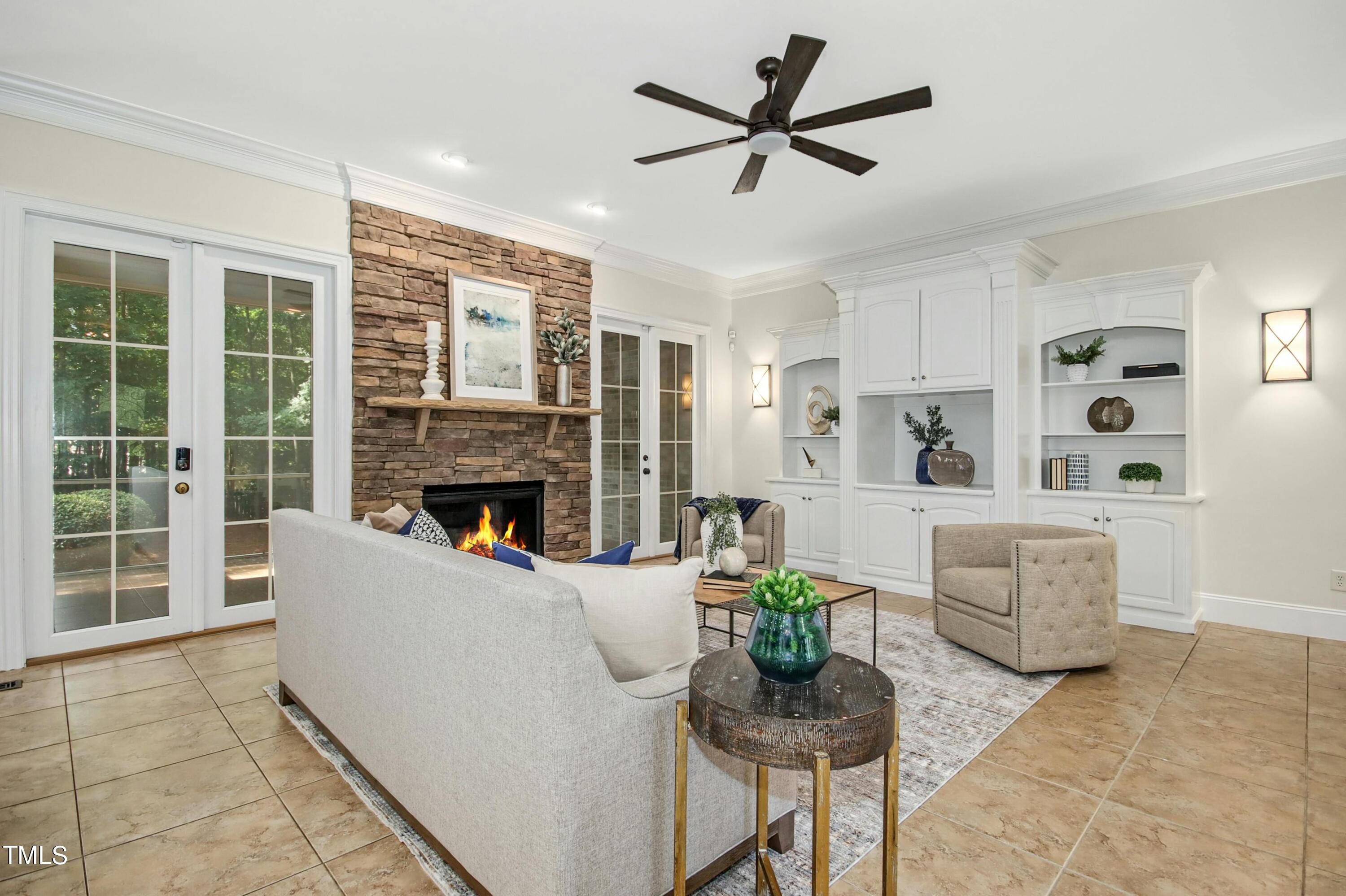 5513 Hickory Leaf Drive Raleigh, NC 27606 - Photo 8 of 41 a living room with furniture and a fireplace