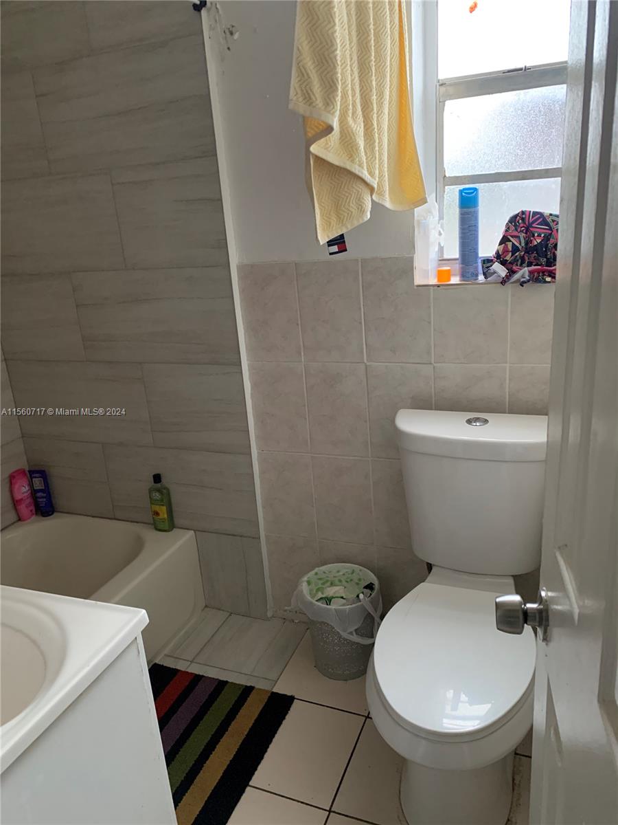 401 Northwest 81st Street Miami, FL 33150 - Photo 6 of 11 a bathroom with a toilet and a sink