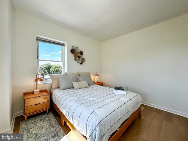 a bedroom with a bed and a window