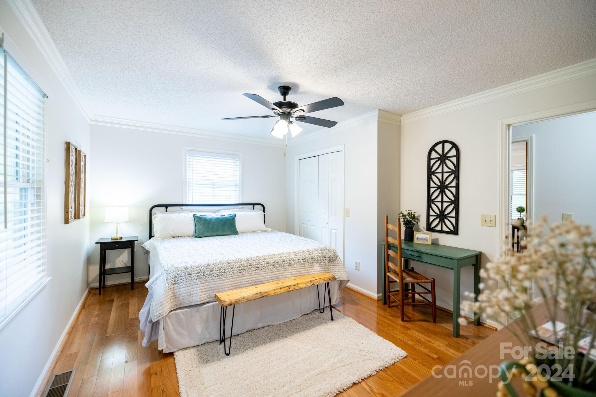 779 Silas Creek Road, Unit 17 & 18 Lansing, NC 28643 - Photo 13 of 35 a bed room with a bed and a table
