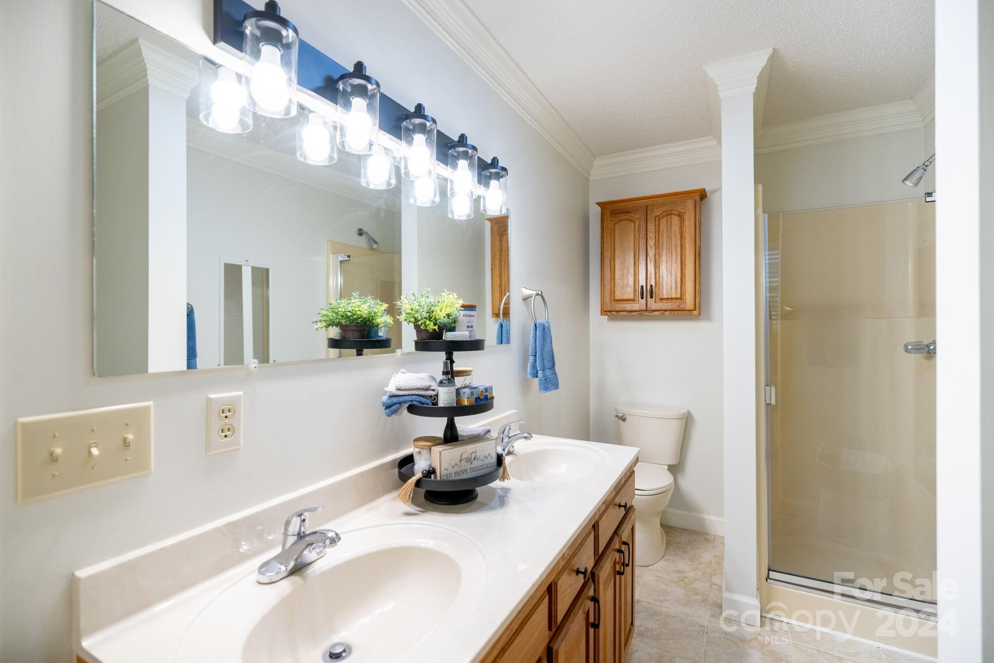 779 Silas Creek Road, Unit 17 & 18 Lansing, NC 28643 - Photo 14 of 35 a bathroom with a sink double vanity and a mirror