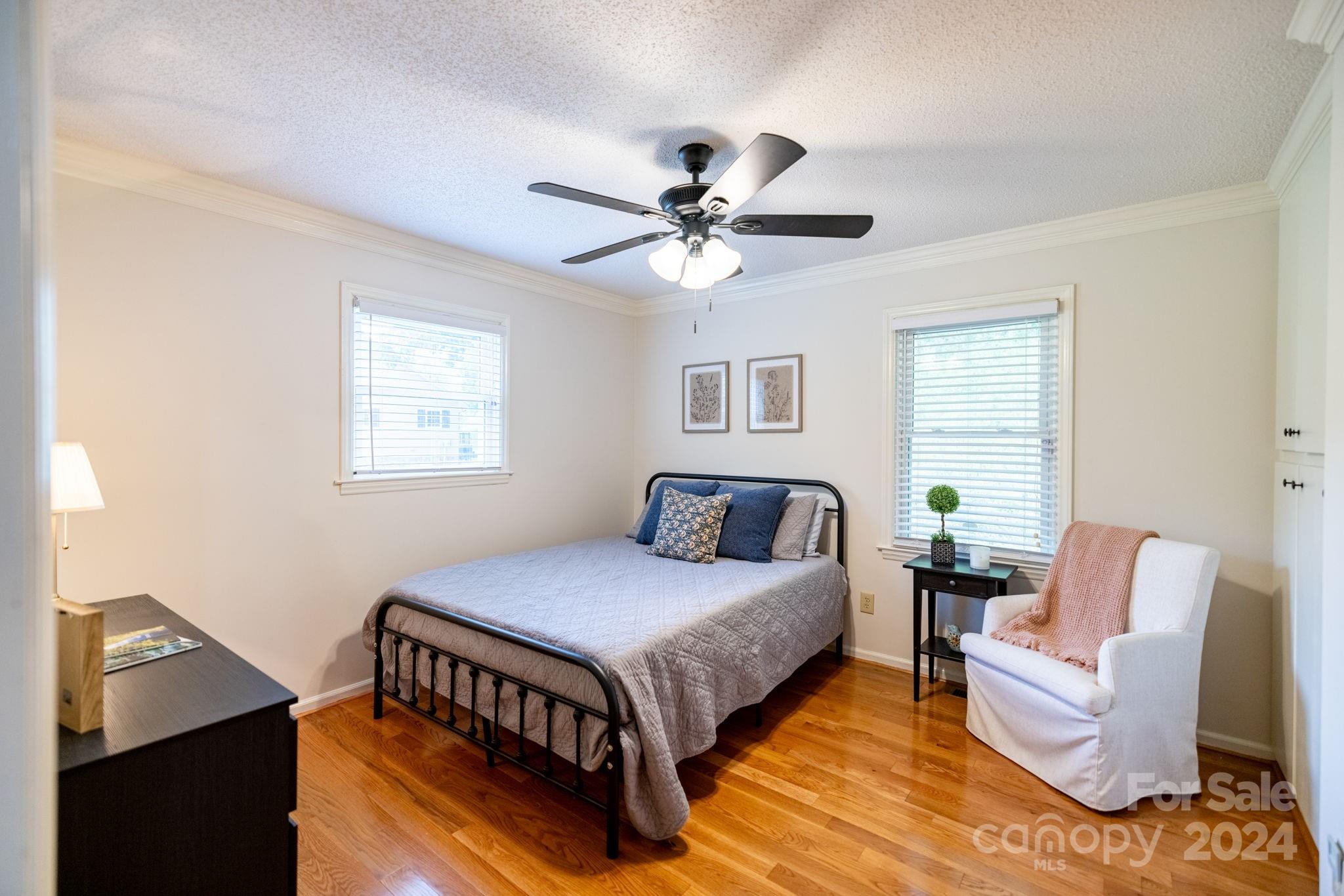 779 Silas Creek Road, Unit 17 & 18 Lansing, NC 28643 - Photo 16 of 35 a bedroom with a bed couch and a window