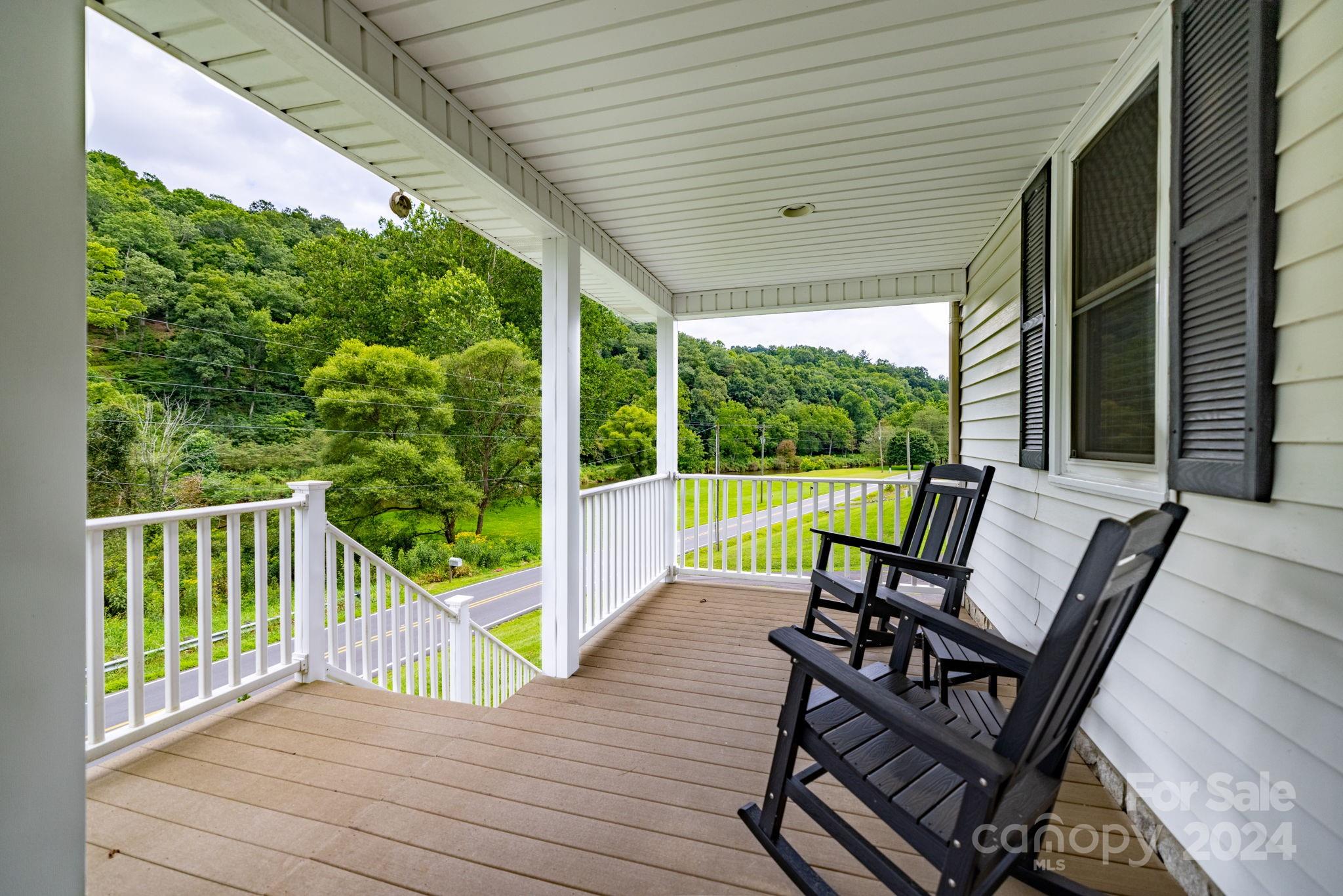 779 Silas Creek Road, Unit 17 & 18 Lansing, NC 28643 - Photo 2 of 35 a view of a two chairs in the balcony