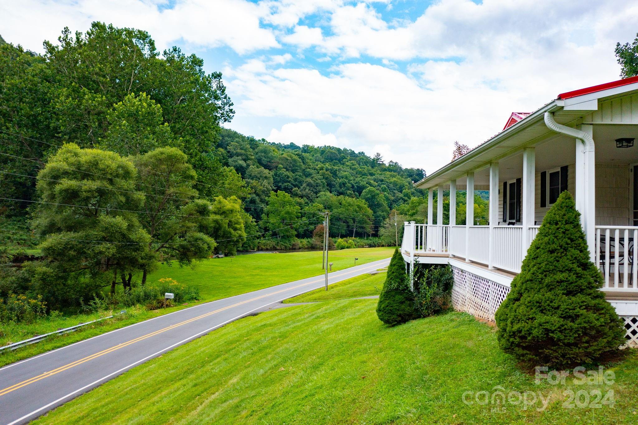 779 Silas Creek Road, Unit 17 & 18 Lansing, NC 28643 - Photo 27 of 35 a view of a house with a backyard and a small yard