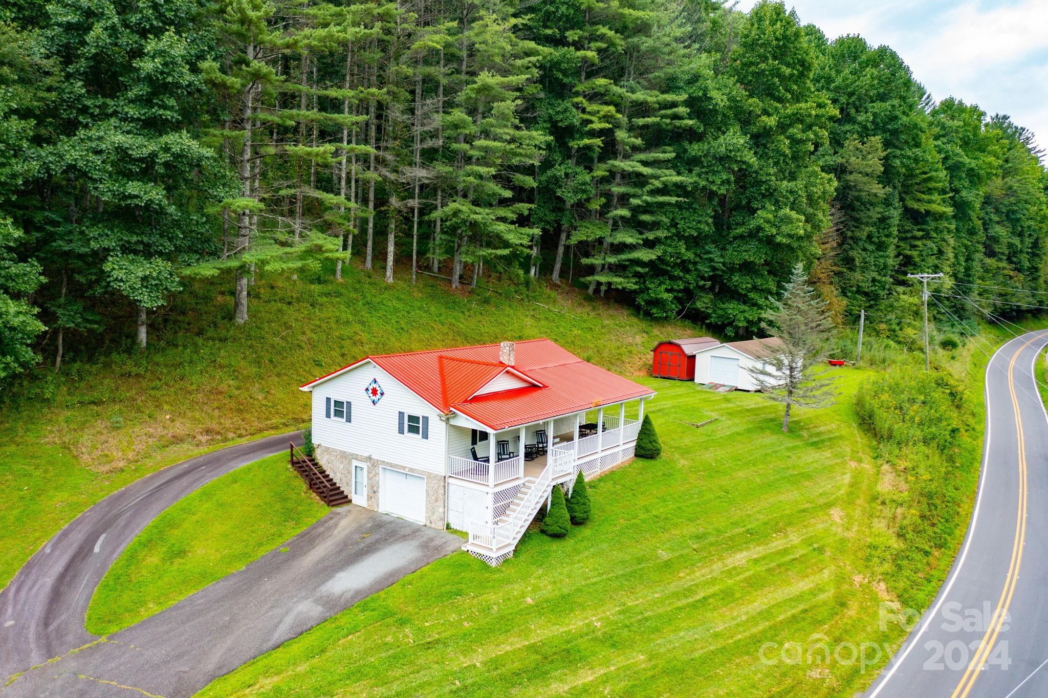 779 Silas Creek Road, Unit 17 & 18 Lansing, NC 28643 - Photo 28 of 35 an aerial view of residential house with outdoor space and swimming pool