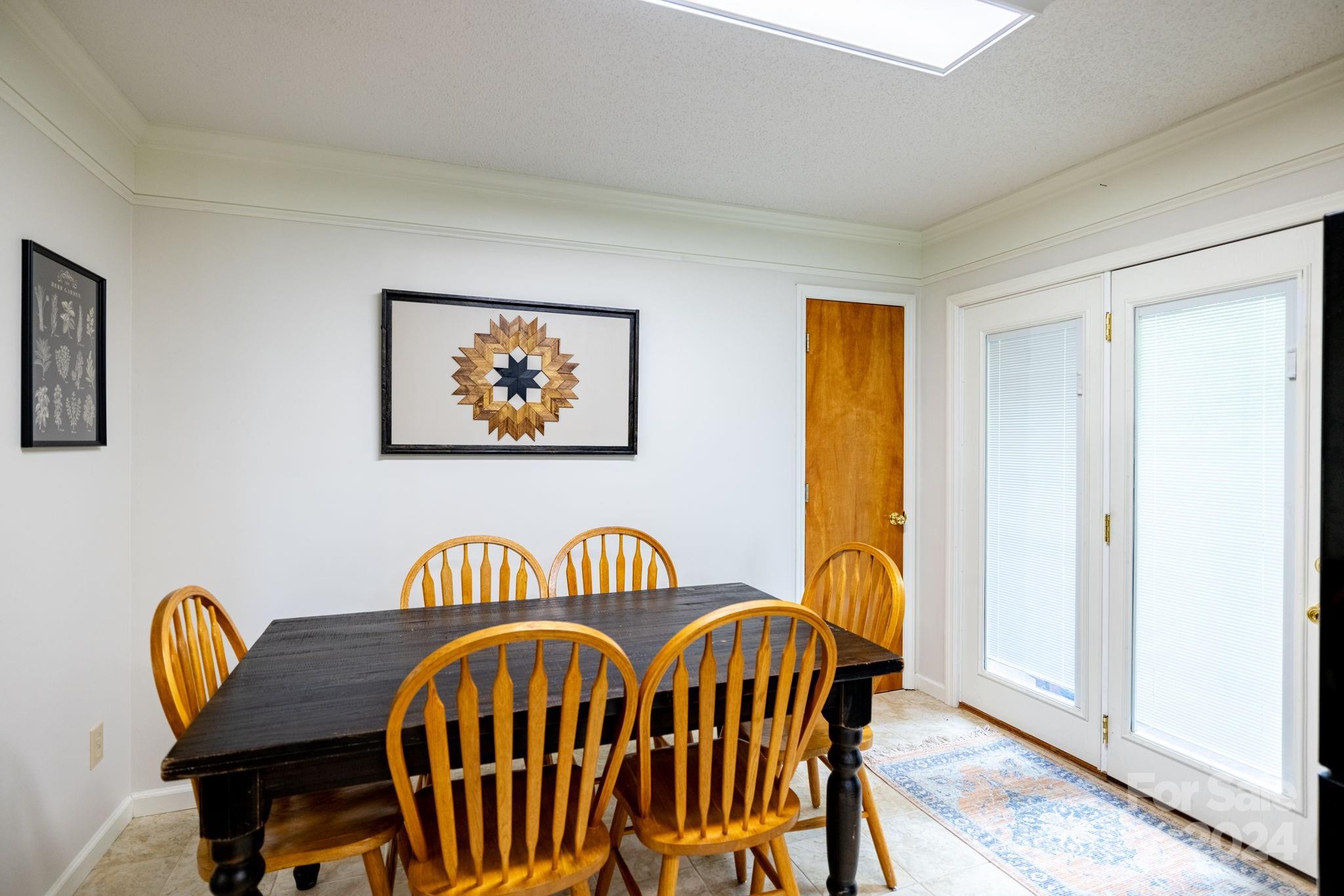 779 Silas Creek Road, Unit 17 & 18 Lansing, NC 28643 - Photo 9 of 35 a view of a dining room with furniture and window
