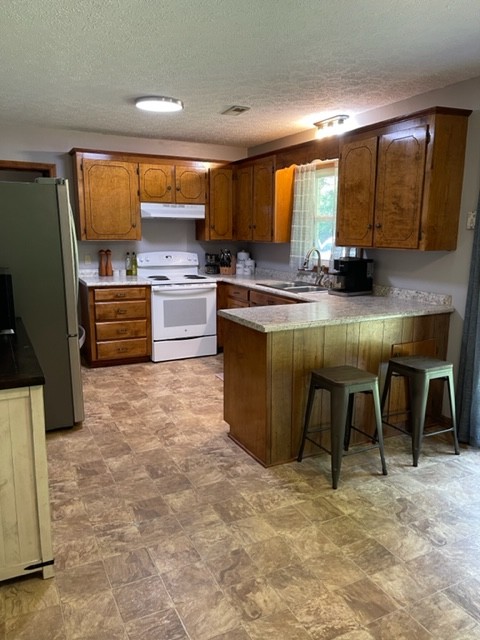 2050 Limekiln Road Tennessee Ridge, TN 37178 - Photo 12 of 37 a kitchen with stainless steel appliances kitchen island granite countertop a stove top oven and cabinets