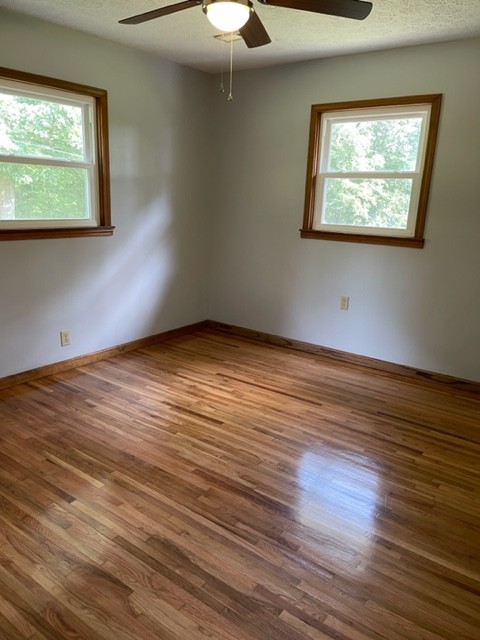2050 Limekiln Road Tennessee Ridge, TN 37178 - Photo 19 of 37 a view of an empty room with wooden floor and a window