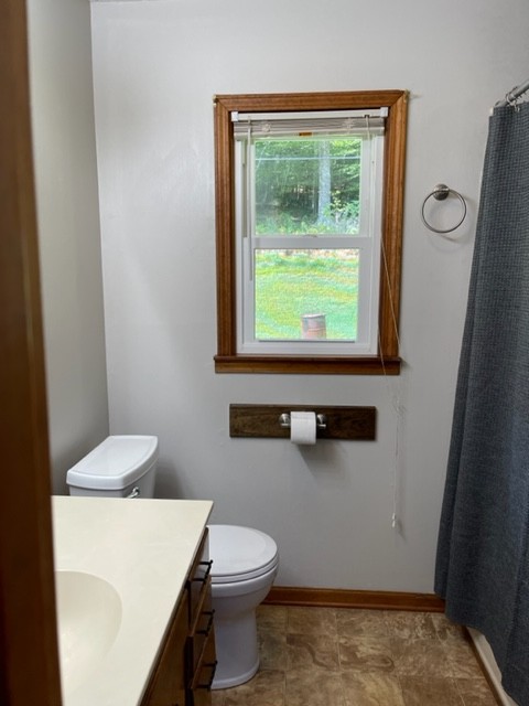 2050 Limekiln Road Tennessee Ridge, TN 37178 - Photo 22 of 37 a bathroom with a toilet a sink and a window