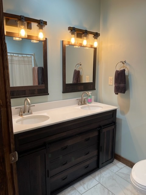 2050 Limekiln Road Tennessee Ridge, TN 37178 - Photo 32 of 37 a bathroom with a double vanity sink and a mirror
