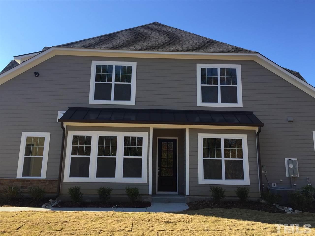 704 Fallon Grove Way Raleigh, NC 27608 - Photo 2 of 15 a front view of a house with a yard