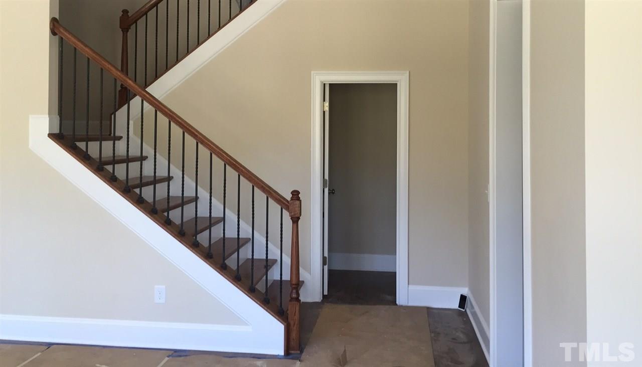 704 Fallon Grove Way Raleigh, NC 27608 - Photo 11 of 15 a view of a hallway with stairs