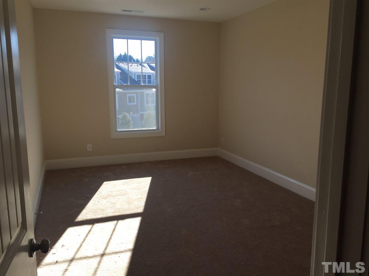 704 Fallon Grove Way Raleigh, NC 27608 - Photo 12 of 15 an empty room with a window
