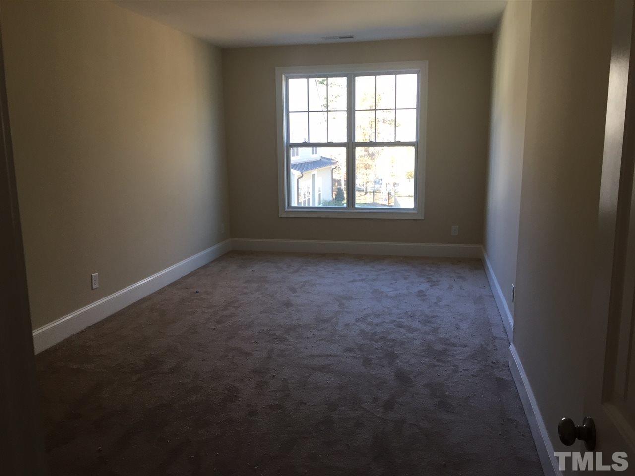704 Fallon Grove Way Raleigh, NC 27608 - Photo 13 of 15 an empty room with a window