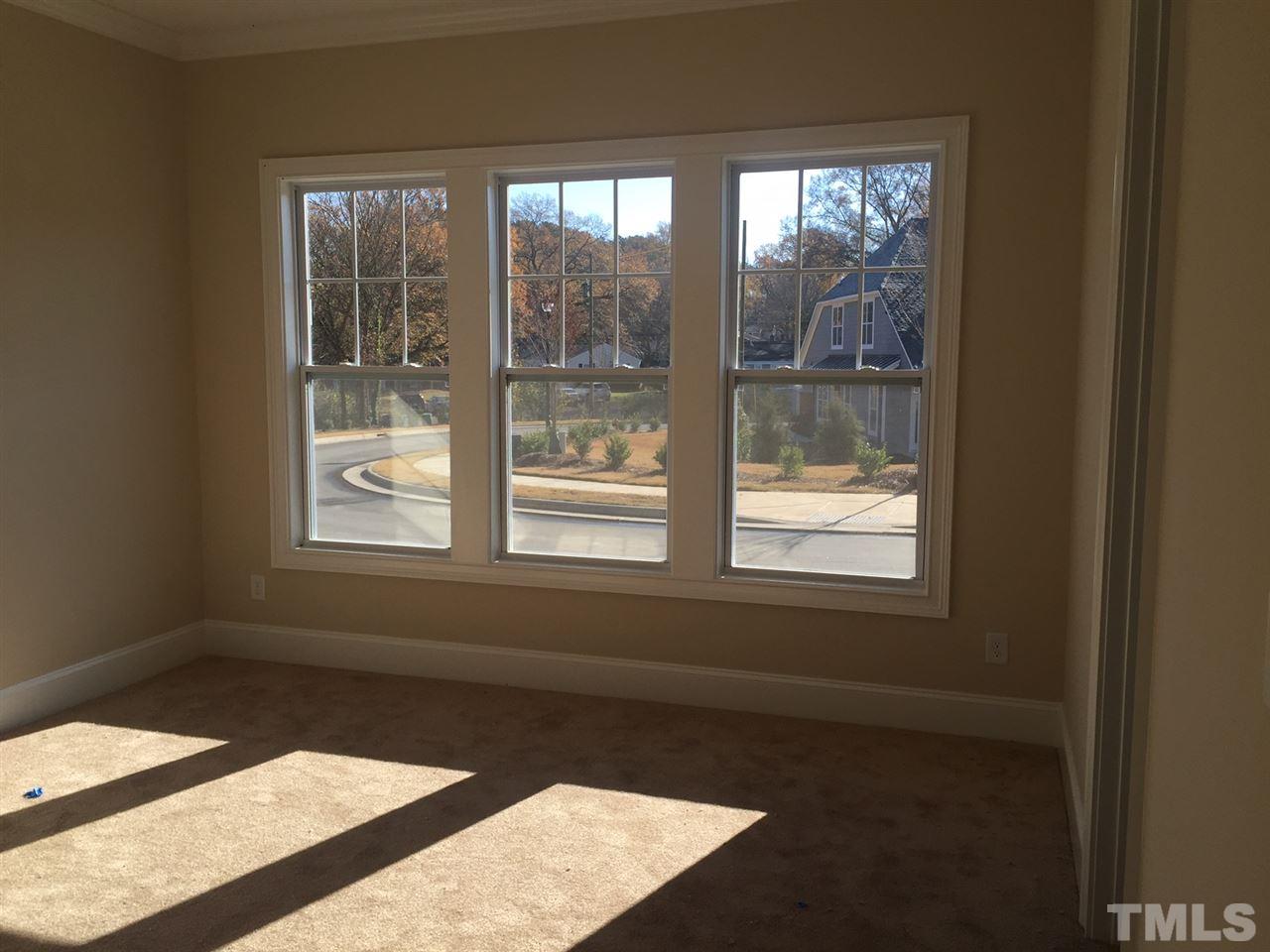 704 Fallon Grove Way Raleigh, NC 27608 - Photo 8 of 15 an empty room with a window