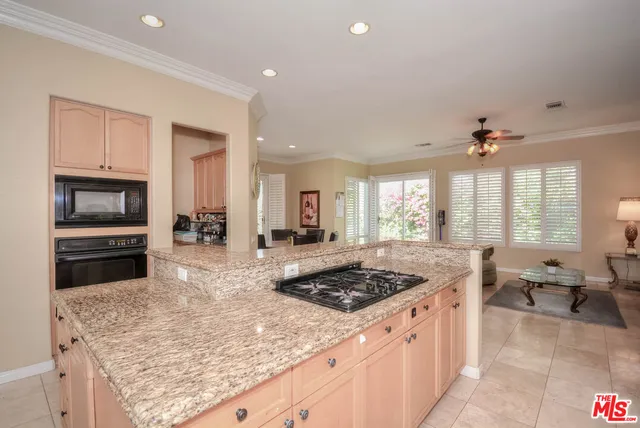 a kitchen with a stove a sink and a refrigerator