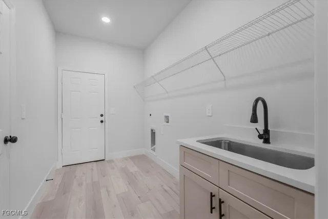 a kitchen with a sink and cabinets