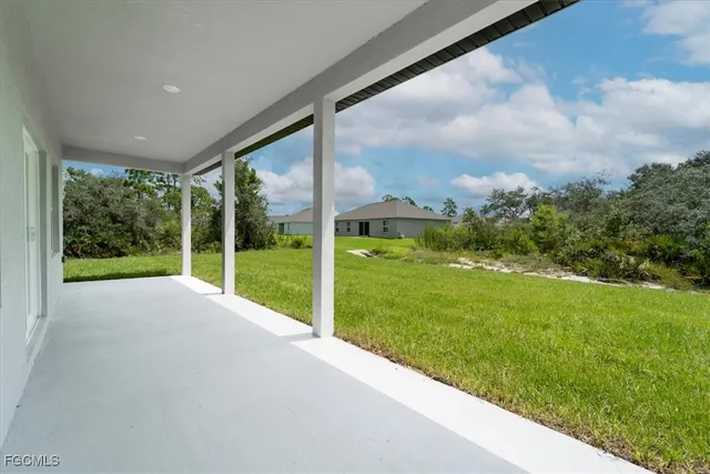 a view of backyard with green space