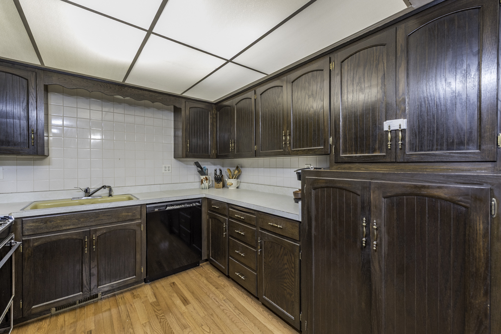 2009 Kedron Boulevard Zion, IL 60099 - Photo 12 of 30 a kitchen with granite countertop stainless steel appliances a sink stove and cabinets