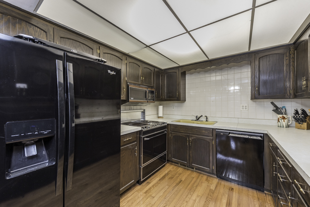2009 Kedron Boulevard Zion, IL 60099 - Photo 14 of 30 a kitchen with stainless steel appliances granite countertop a sink stove and refrigerator