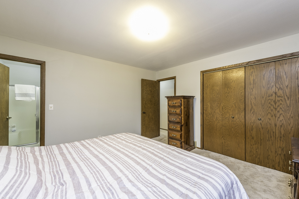 2009 Kedron Boulevard Zion, IL 60099 - Photo 17 of 30 a bedroom with a bed and wooden floor