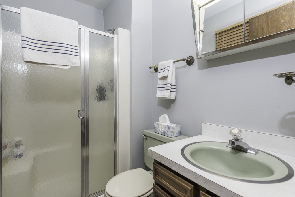 2009 Kedron Boulevard Zion, IL 60099 - Photo 19 of 30 a bathroom with a sink a toilet and shower
