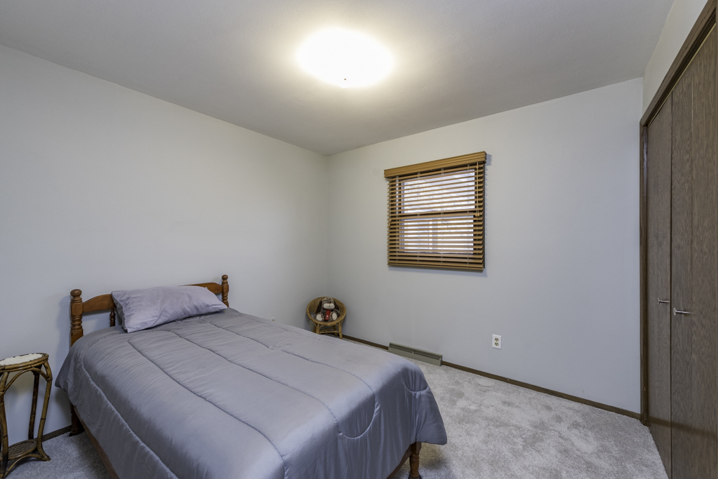 2009 Kedron Boulevard Zion, IL 60099 - Photo 20 of 30 a bedroom with a bed and window