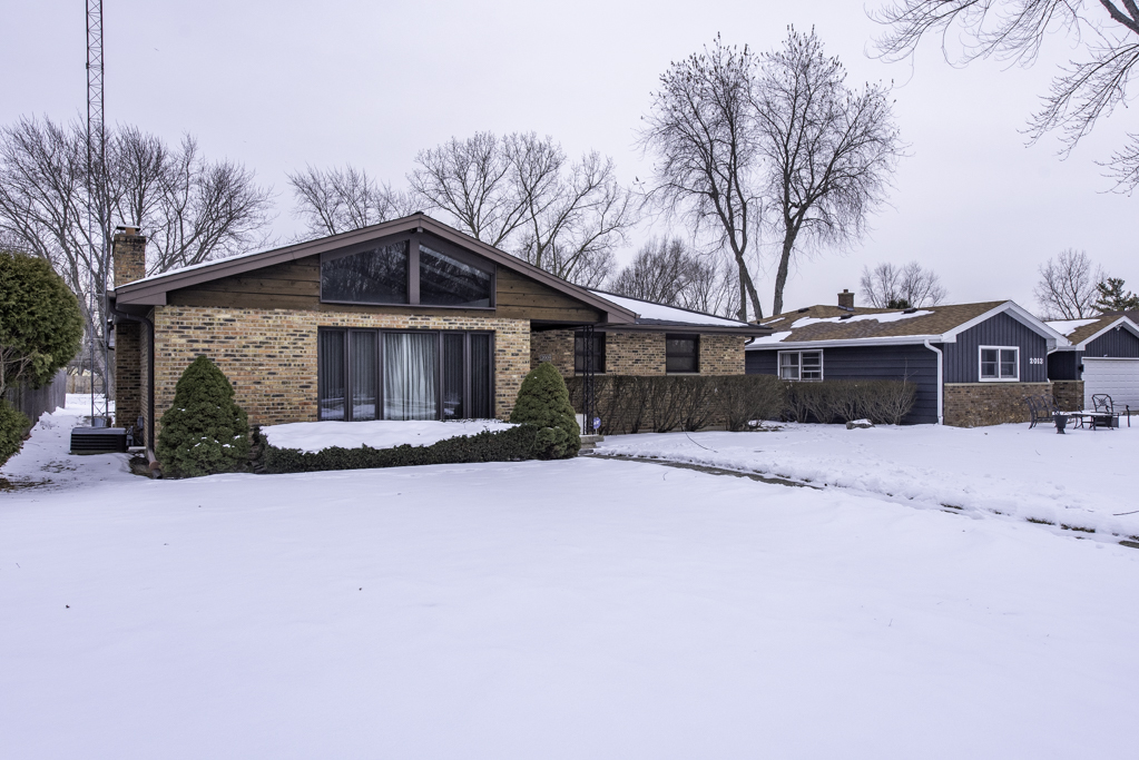 2009 Kedron Boulevard Zion, IL 60099 - Photo 23 of 30 a front view of a house with a yard covered with snow