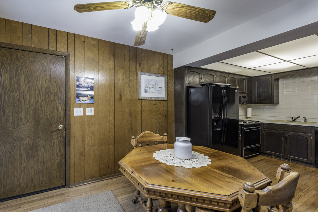 2009 Kedron Boulevard Zion, IL 60099 - Photo 7 of 30 a kitchen with stainless steel appliances kitchen island granite countertop a refrigerator a stove a sink dishwasher with a dining table and chairs