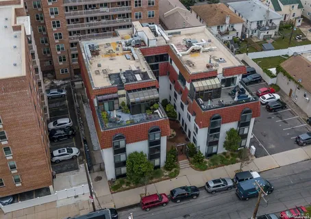 an aerial view of residential houses with outdoor space