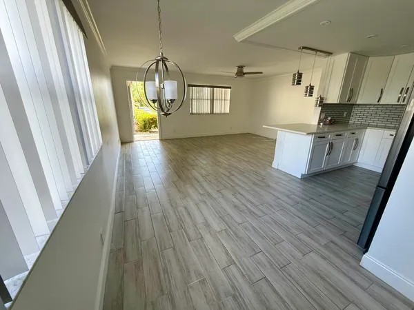 a view of kitchen and wooden floor