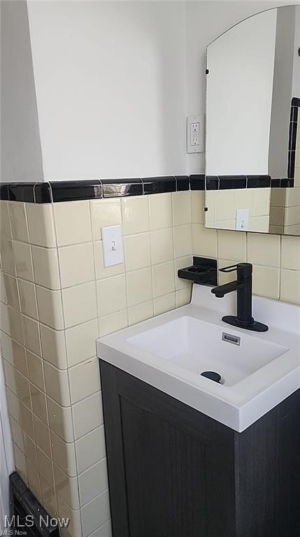 23621 Colbourne Road Euclid, OH 44123 - Photo 9 of 45 Bathroom featuring vanity and tile walls