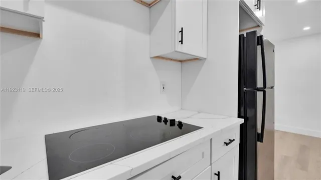 a kitchen with a sink and cabinets