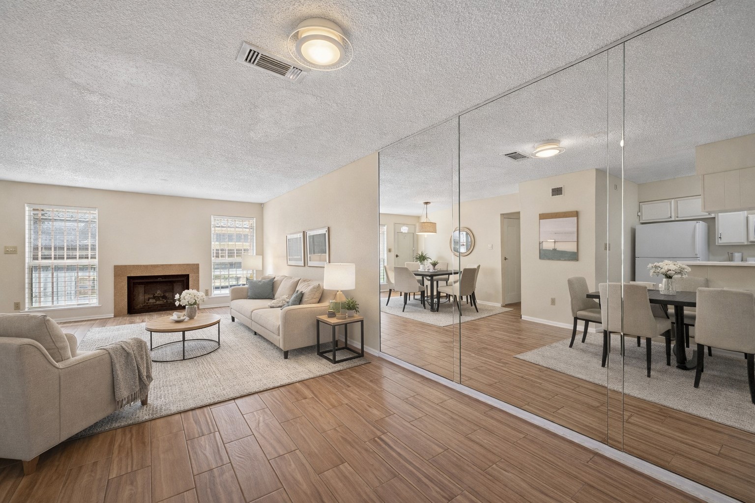 3100 Jeanetta Street, Unit 1004 Houston, TX 77063 - Photo 15 of 42 This staged view focuses on the floor-to-ceiling mirrors, illustrating a clever design trick that amplifies the home's open-concept dimensions. (Virtually staged)