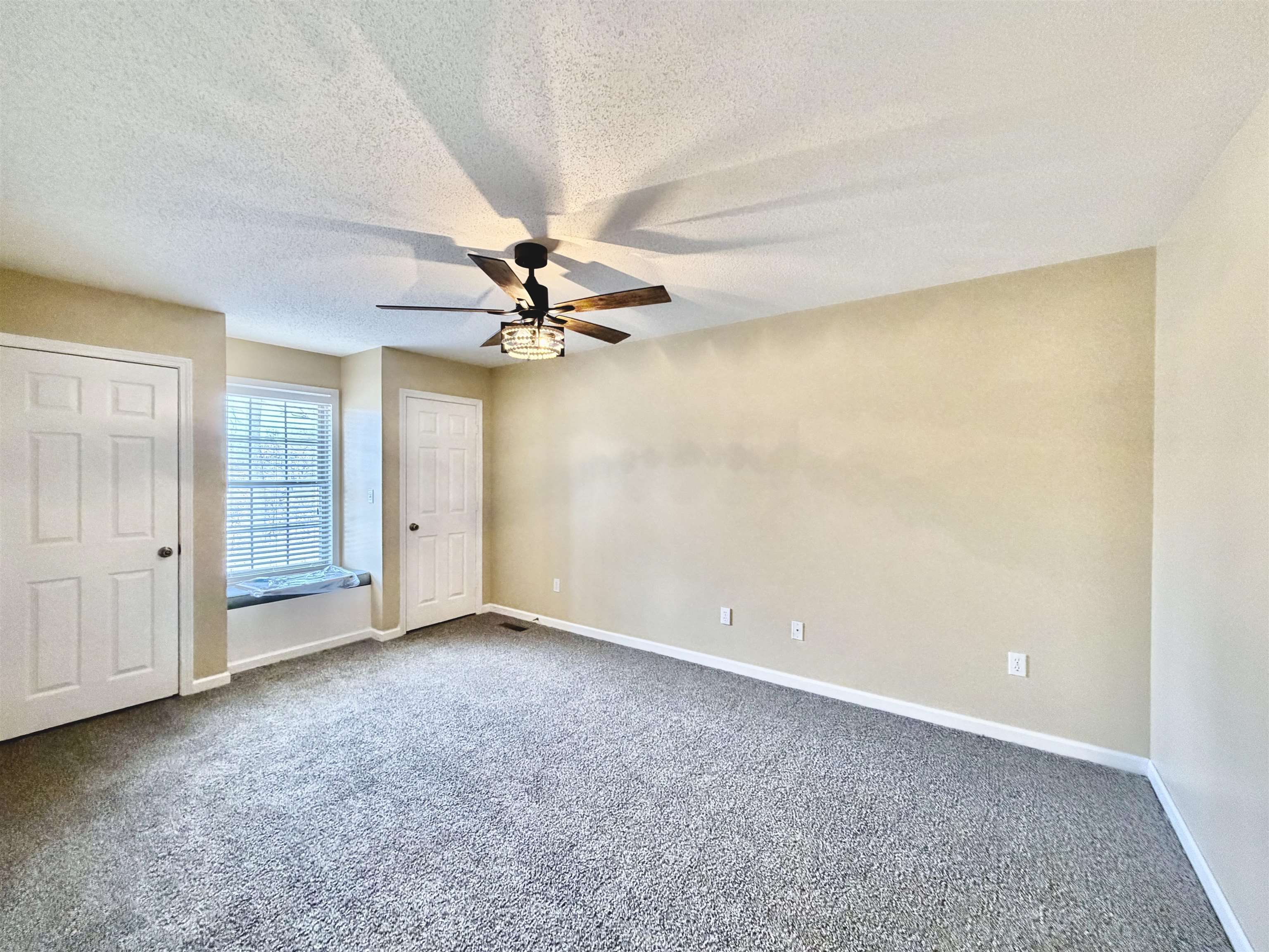 1086 Sloan Road Burlison, TN 38015 - Photo 14 of 24 Carpeted empty room with a textured ceiling and a ceiling fan