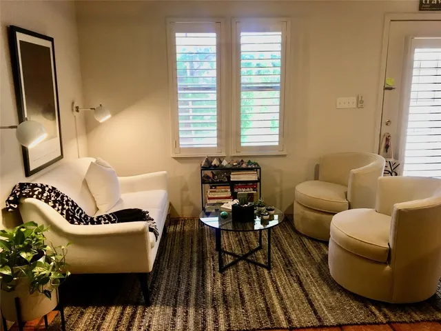 a living room with furniture and a window