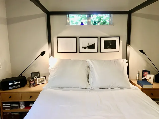 a picture of a room with two windows