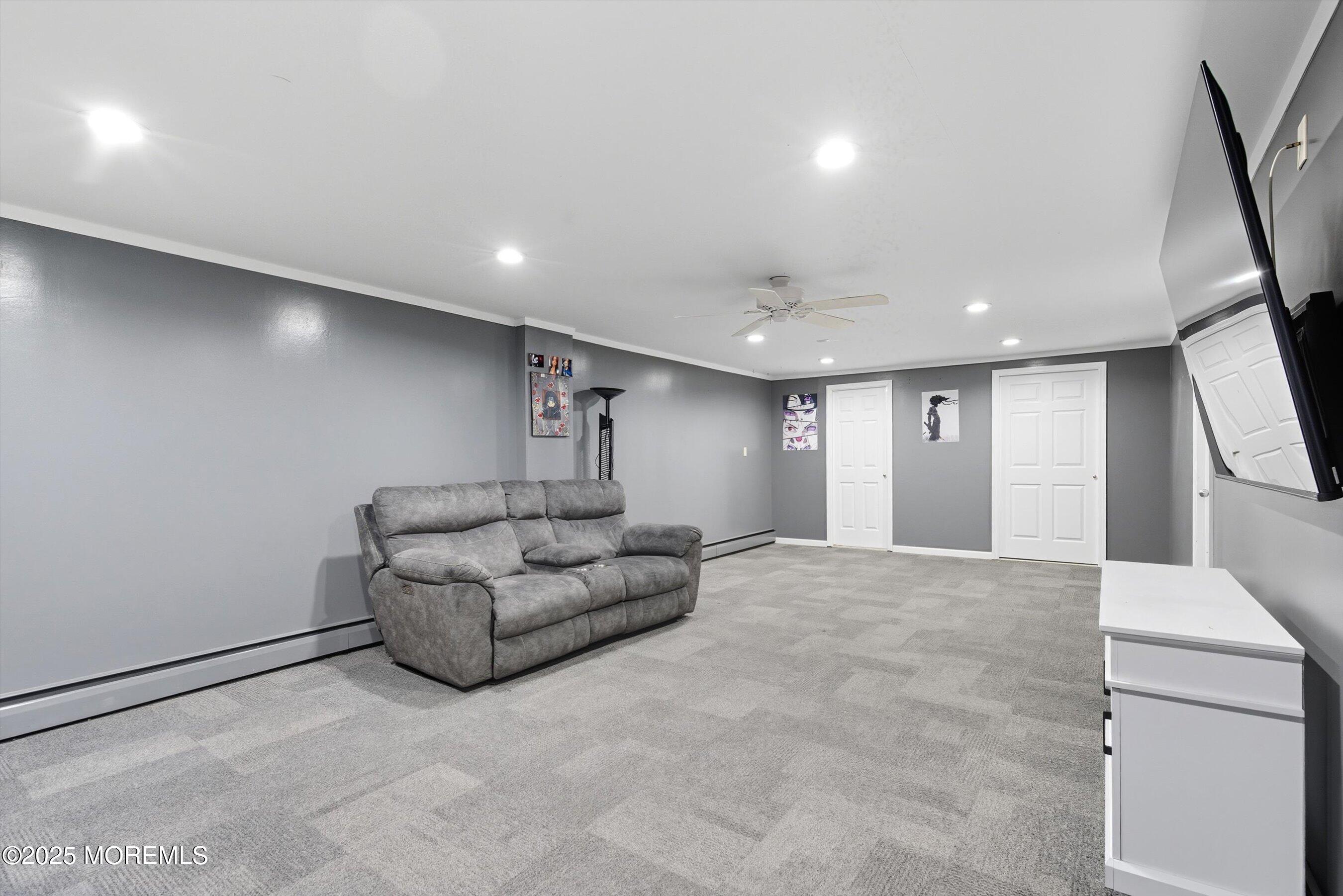 210 Coolidge Avenue Absecon, NJ 08201 - Photo 14 of 28 a living room with furniture and a large mirror