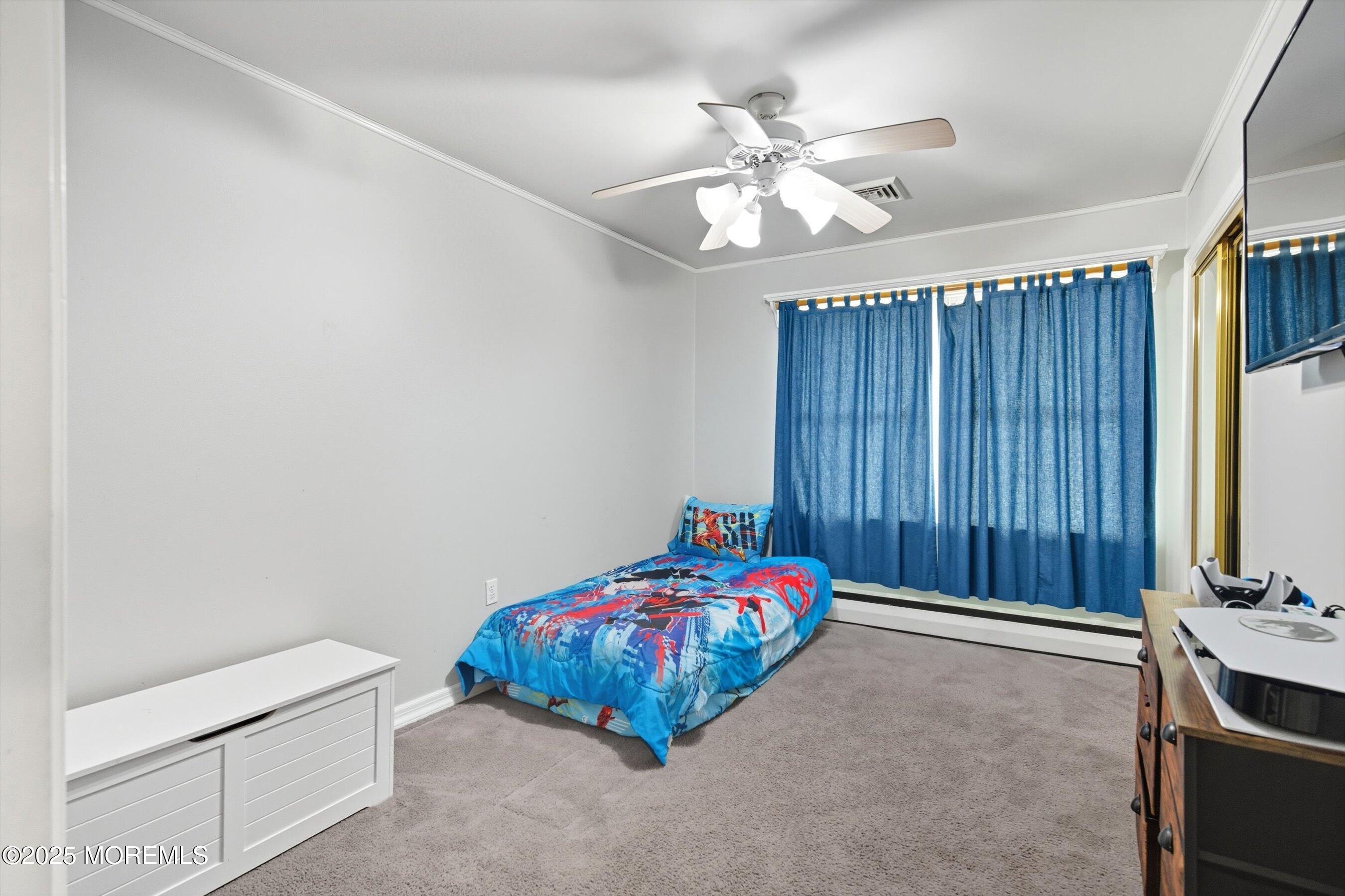 210 Coolidge Avenue Absecon, NJ 08201 - Photo 15 of 28 a bedroom with furniture and chandelier