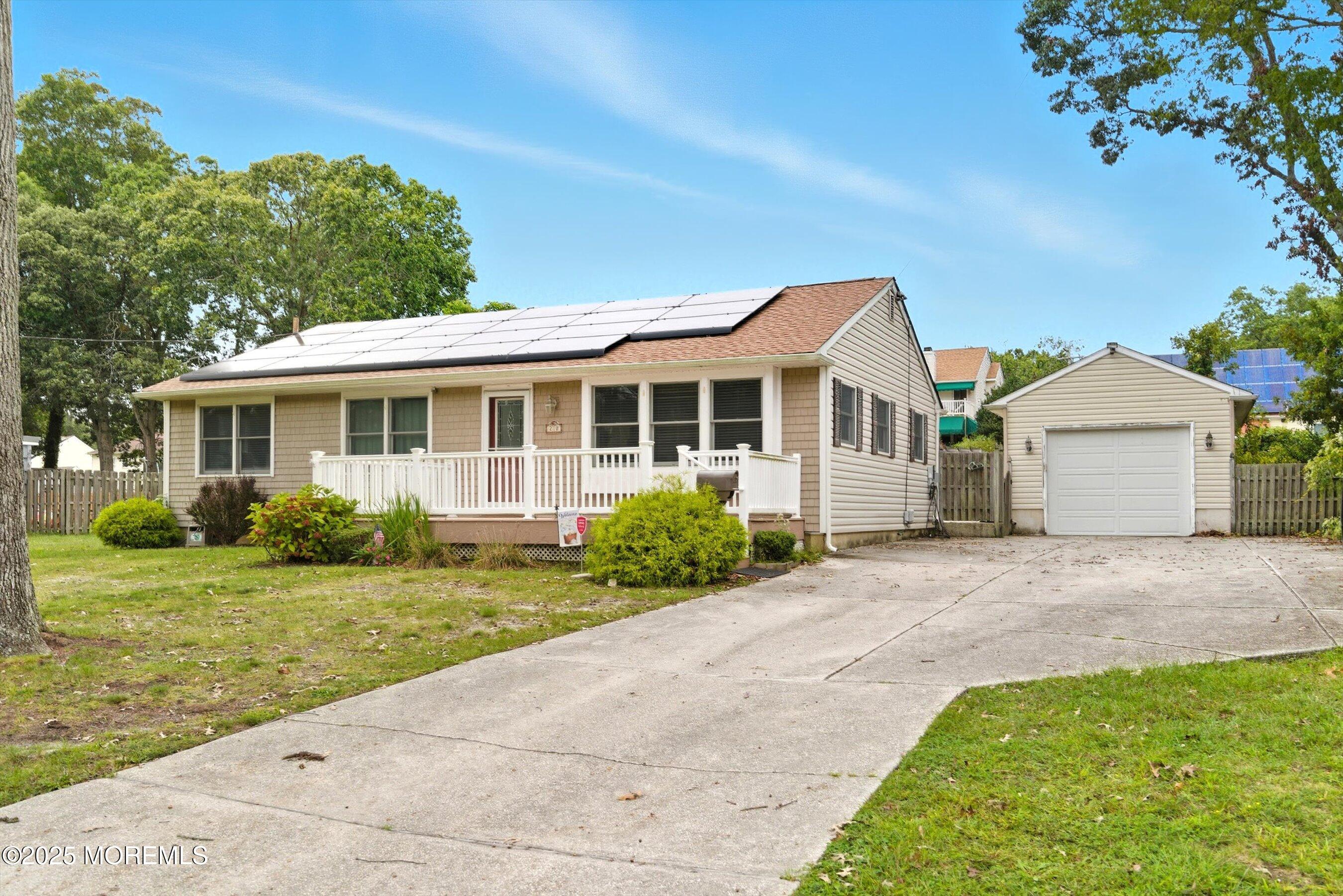210 Coolidge Avenue Absecon, NJ 08201 - Photo 2 of 28 a front view of a house with a yard and garage