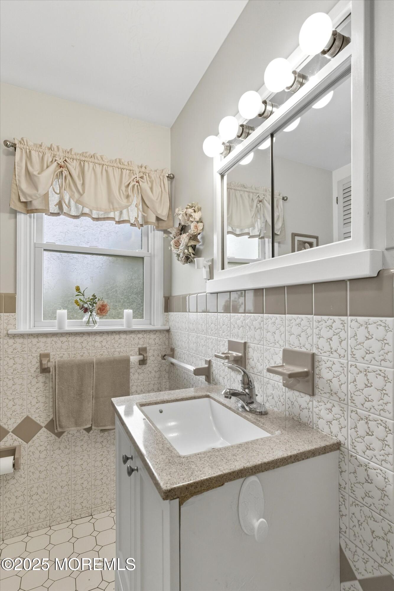 210 Coolidge Avenue Absecon, NJ 08201 - Photo 23 of 28 a bathroom with a sink and a mirror