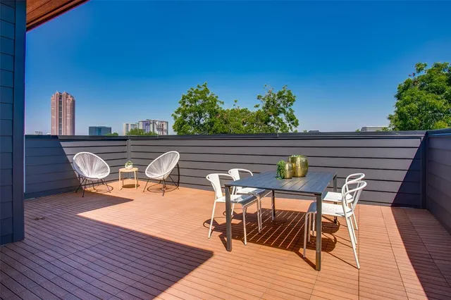 a view of sitting area with furniture and wooden floor