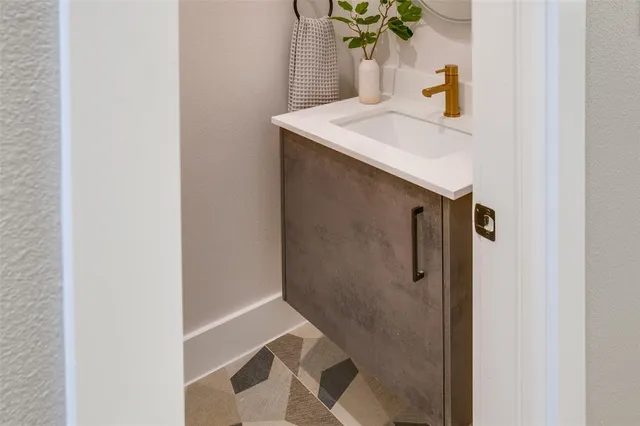 a bathroom with a tub sink and mirror
