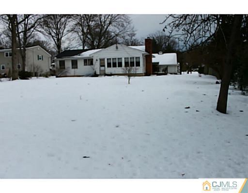 10 Bradford Road Edison, NJ 08820 - Photo 13 of 13 a view of a house with a snow in the background