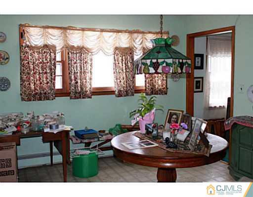 10 Bradford Road Edison, NJ 08820 - Photo 4 of 13 a view of a dining room with furniture window and outdoor kitchen