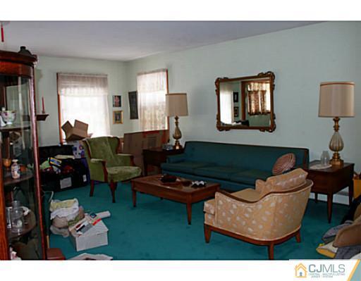 10 Bradford Road Edison, NJ 08820 - Photo 5 of 13 a living room with furniture and a wooden floor