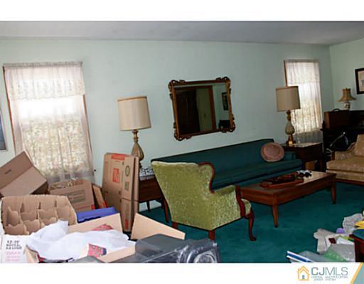 10 Bradford Road Edison, NJ 08820 - Photo 6 of 13 a living room with furniture and a window